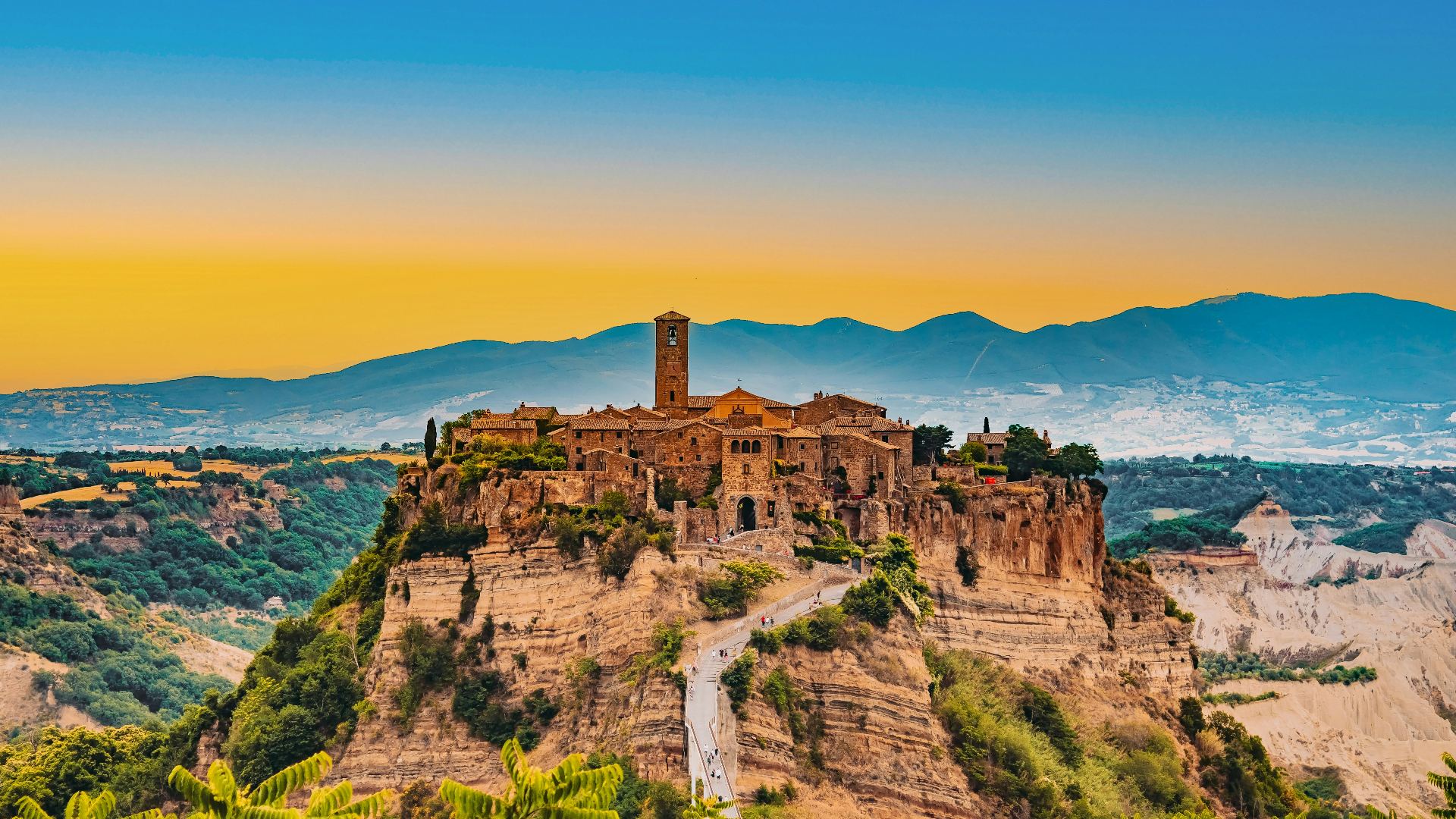 Civita di Bagnoregio, the dying city, seen at sunset on its tuff cliff
