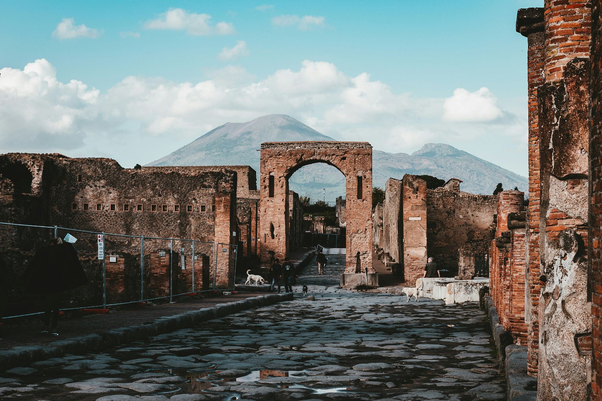 Ruins of Pompeii with Vesuvius in the background and the forum arch in the foreground